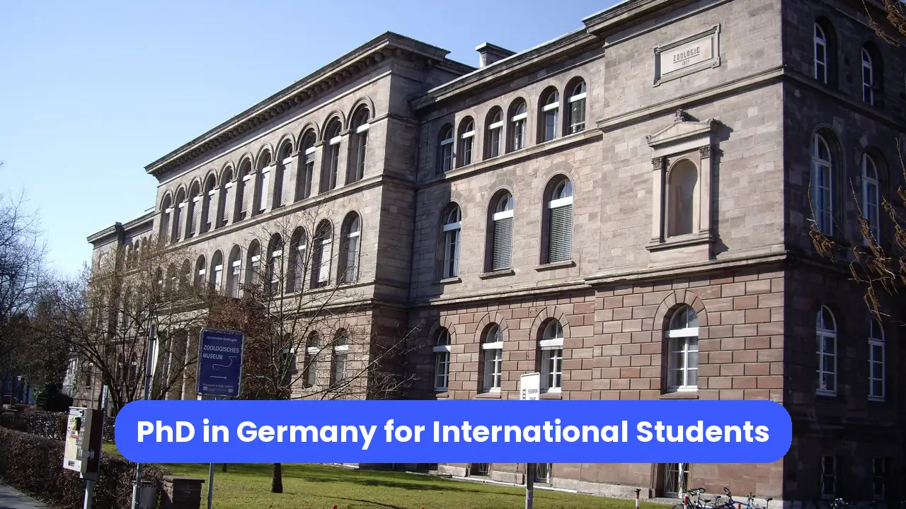Photo of the Goettingen Zoology Institute building, with a blue title banner.