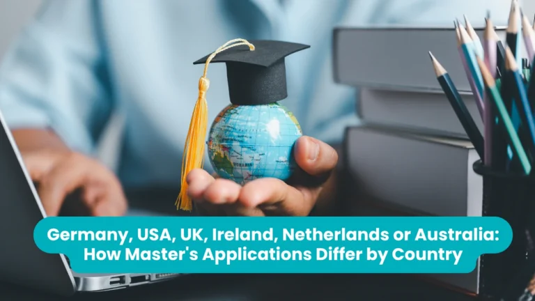 Banner reading 'Germany, USA, UK, Ireland, Netherlands or Australia: How Master's Applications Differ by Country' across a photograph of a hand holding a small globe topped with a black graduation cap and gold tassel beside a laptop and a stack of books