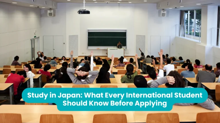 Study in Japan: students raising their hands to answer a question in a large university lecture hall
