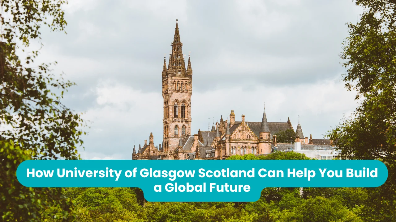 The University of Glasgow's Gilbert Scott Building, its tall Gothic spire rising above turreted sandstone rooftops, framed by green trees under a bright overcast sky