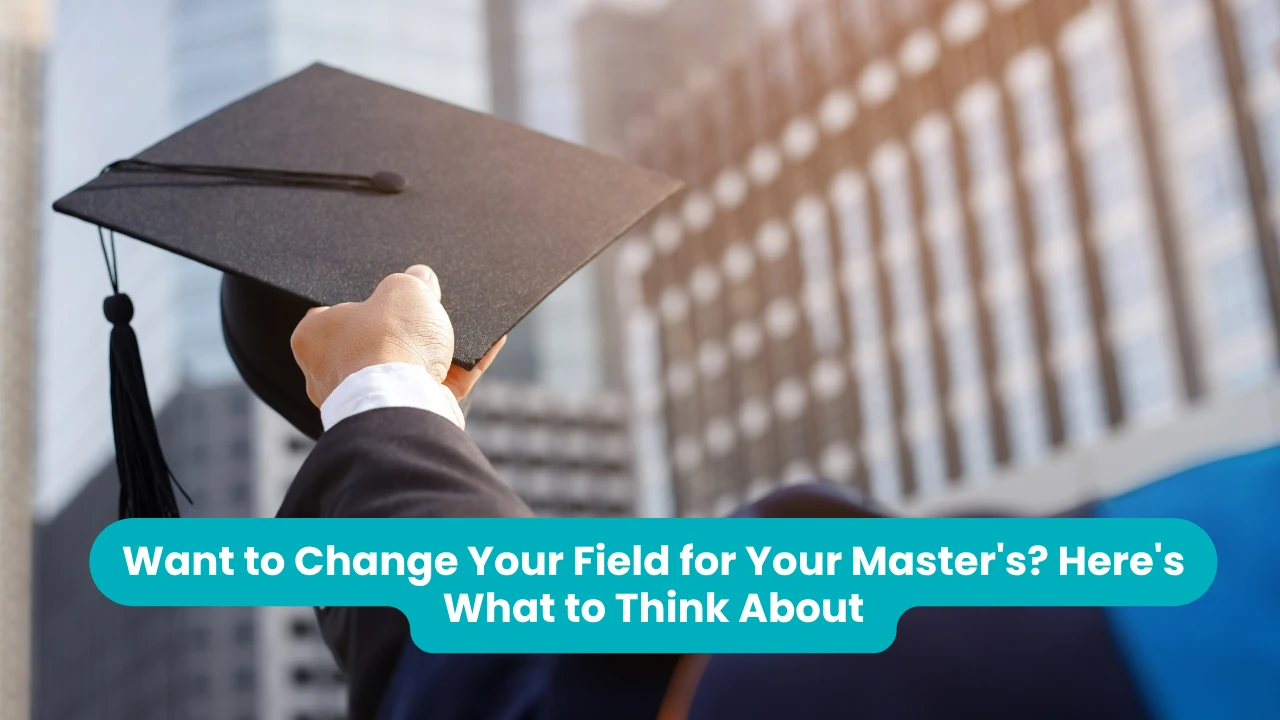 Banner reading 'Want to Change Your Field for Your Master's? Here's What to Think About' across a photograph taken from below of a graduate in a dark suit raising a mortarboard overhead, with tall office buildings out of focus behind them