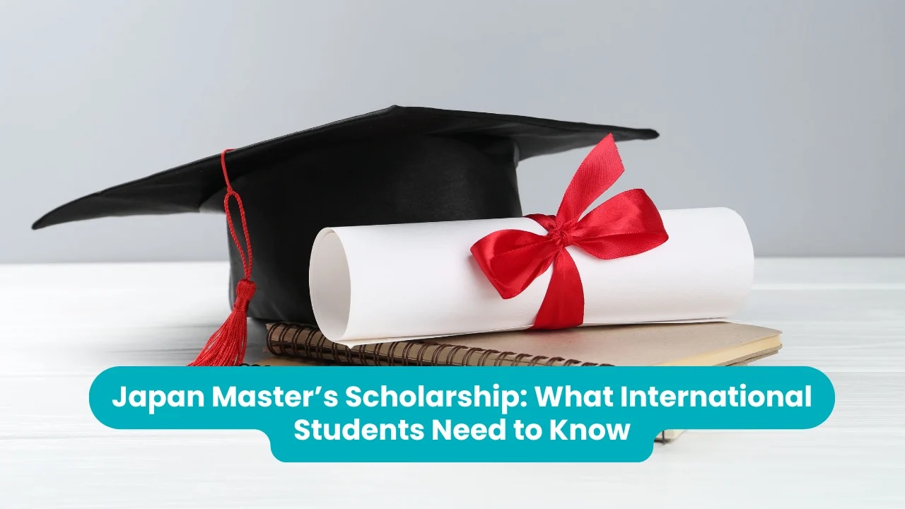 Banner reading 'Japan Master’s Scholarship: What International Students Need to Know' across a photograph of a black graduation cap with a red tassel beside a rolled diploma tied with a red ribbon, resting on a spiral notebook