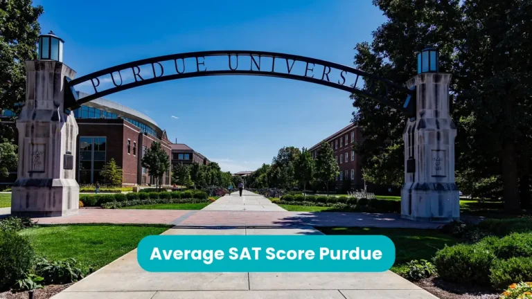 Banner reading 'Average SAT Score Purdue' across a photograph of the Purdue University entrance arch, lettered PURDUE UNIVERSITY, over a paved campus walkway on a sunny day