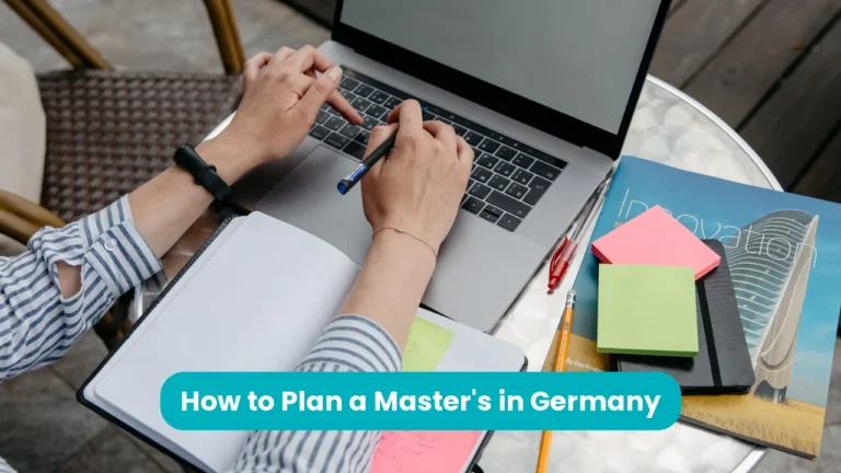 Banner reading 'How to Plan a Master's in Germany' across a photograph of hands at a laptop on a cafe table, holding a pen beside an open notebook, a pad of pink and green sticky notes and a magazine